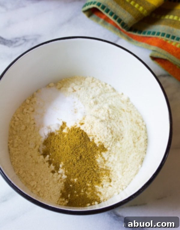 Bowl filled with dry ingredients for masa shell, ready to be mixed.