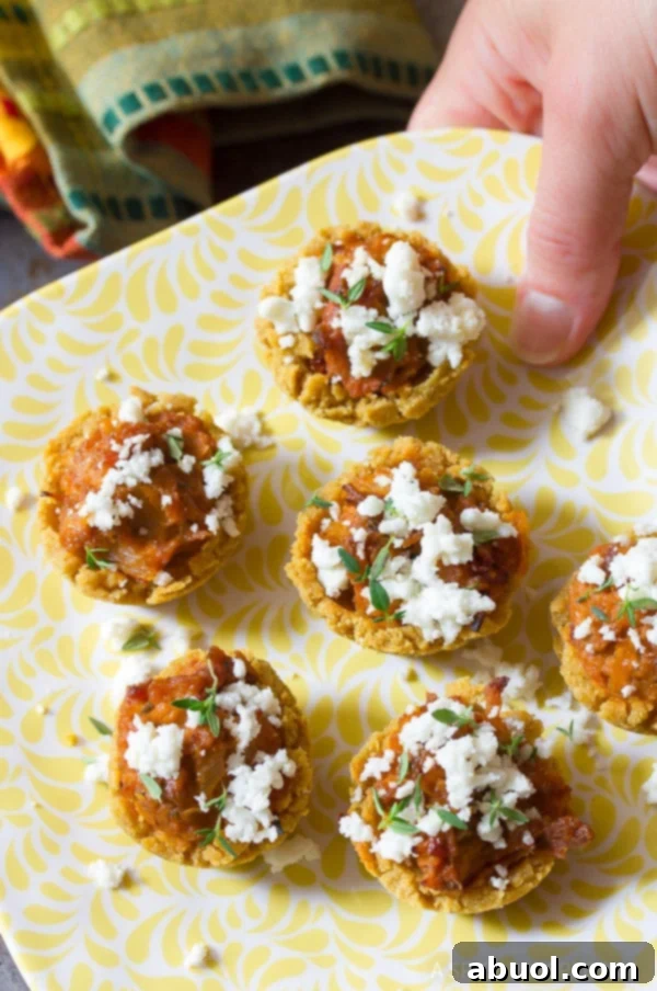 Close up shot of small, delicious appetizers arranged on a vibrant yellow plate.
