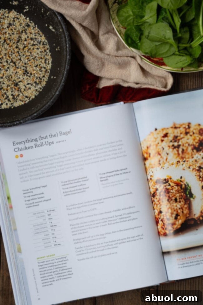 An open page of SkinnyTaste's cookbook, featuring the 'Everything (but the) Bagel Chicken Roll-Ups' recipe, highlighting its simplicity and appeal.