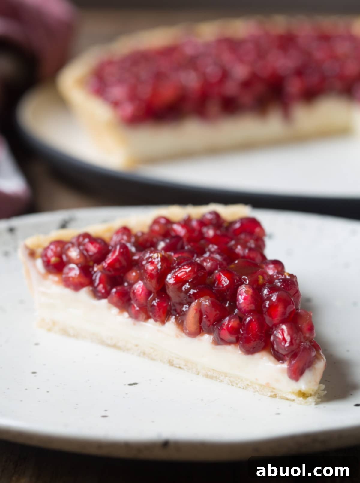 Simple Pomegranate Cream Cheese Tart Recipe - cut on plate 