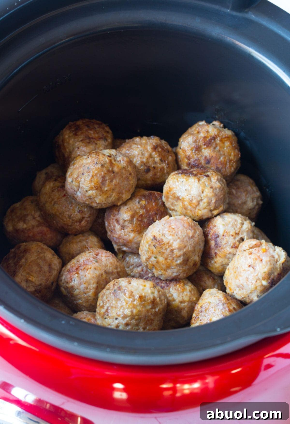Place your either homemade or frozen meatballs into the slow cooker