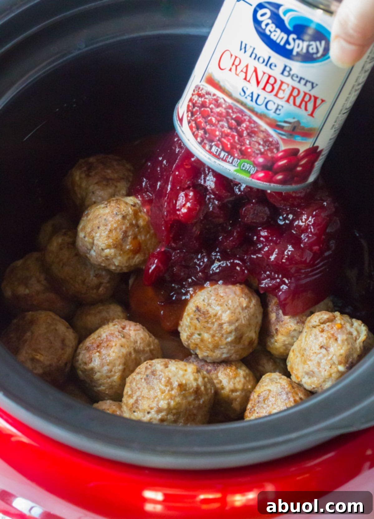 In the Crock-Pot on top of the Main Ingredients add in your canned whole cranberry sauce