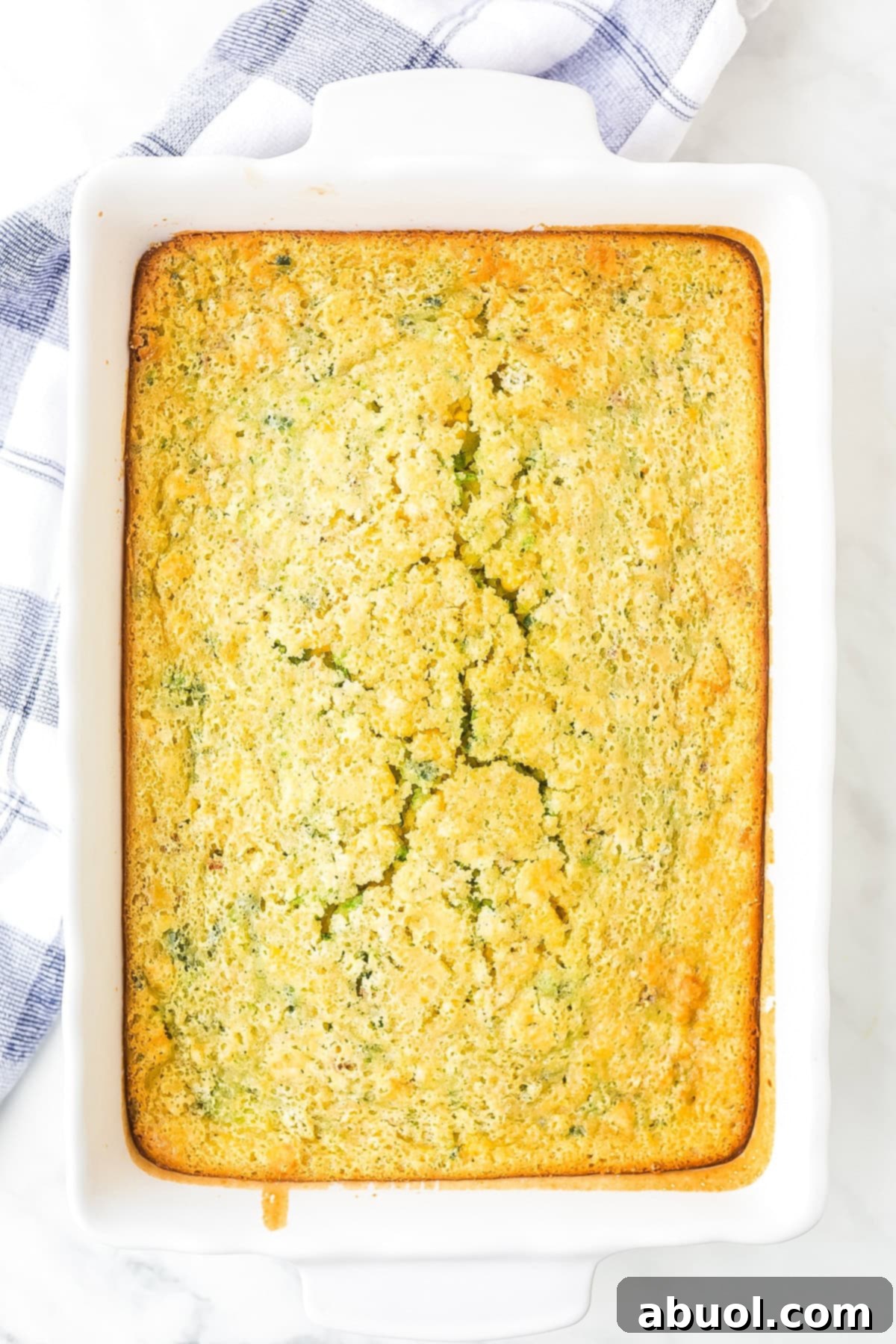 Top view of the final 12 Bones corn pudding recipe in a rustic casserole dish, ready to be served.
