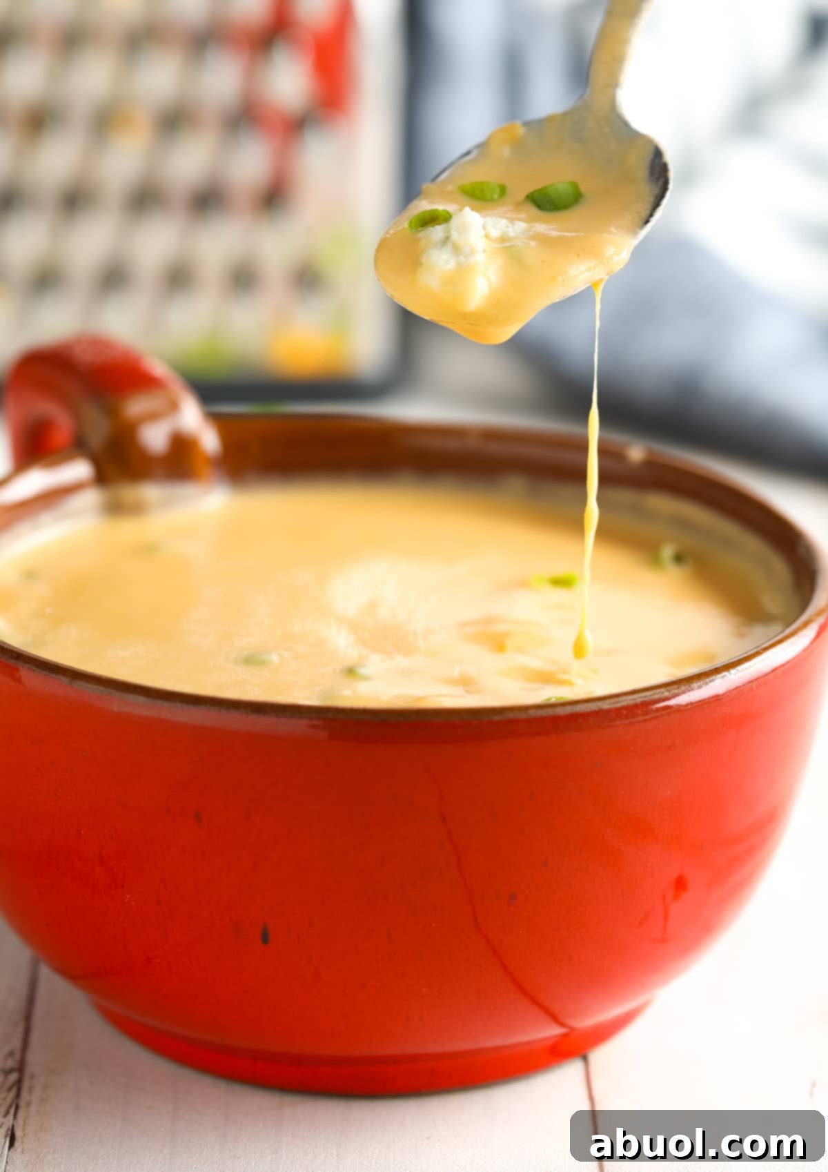 Buffalo Cauliflower Soup Recipe lifted with spoon.