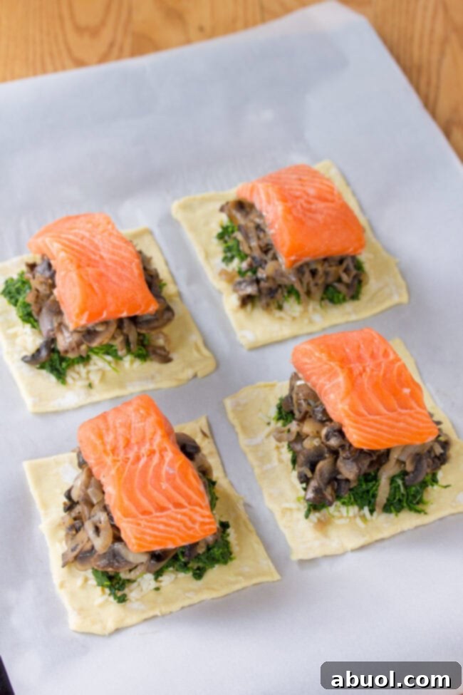 Gourmet Salmon En Croute 7 Layering salmon, rice, mushrooms, and spinach on puff pastry for Coulibiac