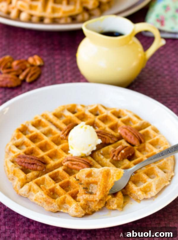 Crispy Spelt Waffles on a plate, looking absolutely delicious and ready to be enjoyed.