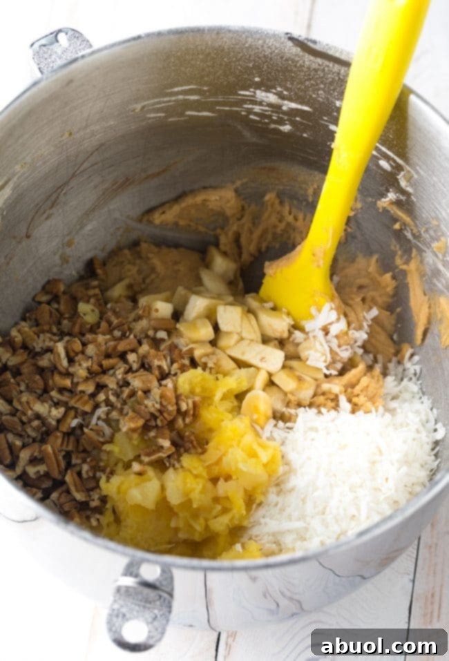 Pina Colada Blondies 5 Ingredients for hummingbird blondies being mixed in a large mixing bowl.