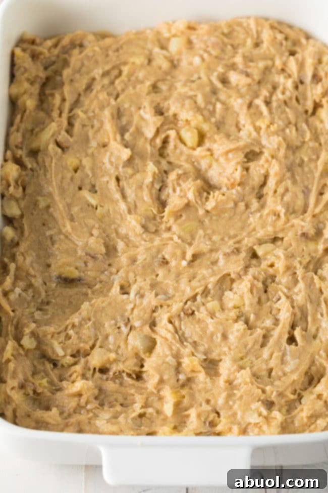 Pina Colada Blondies 6 Blondie cookie dough spread into a baking dish.