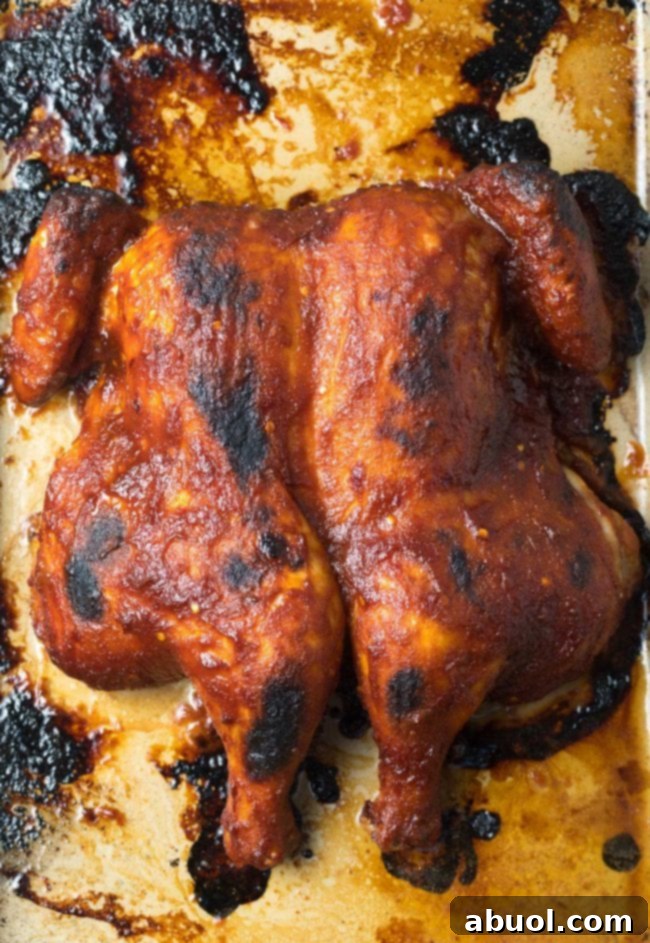 Baked coca cola chicken, glistening and ready to be carved.