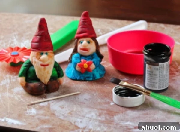 Homemade Fondant Magic 15 Fondant garden gnomes painted with edible colors, showing detailed decorative capabilities.