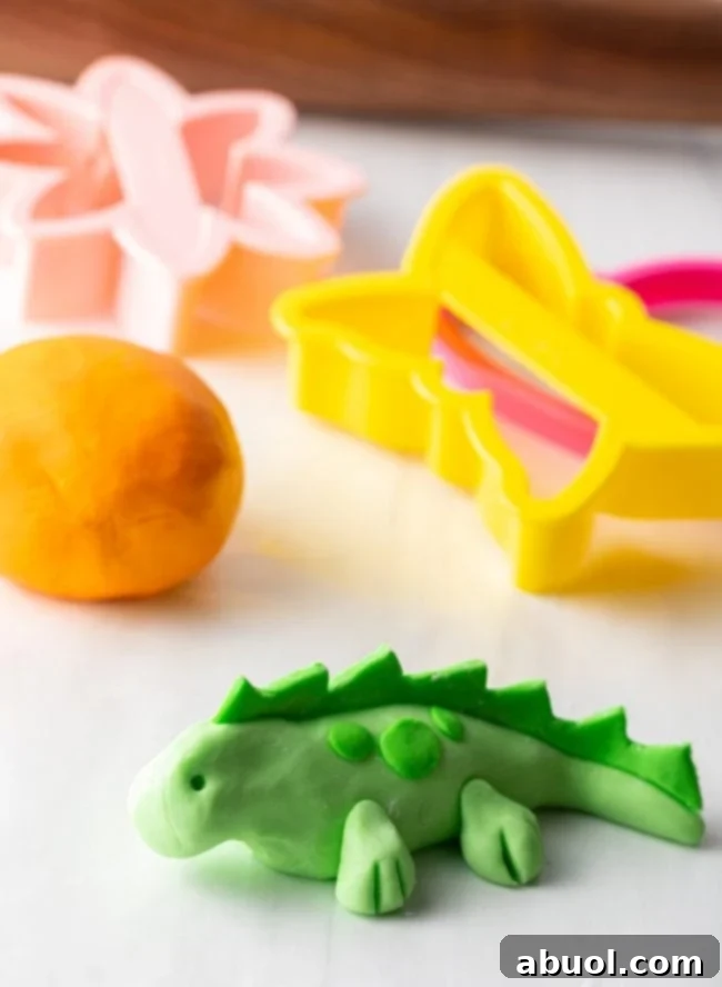 fondant-mushrooms.jpg A vibrant green lizard figurine crafted from homemade marshmallow fondant, highlighting its excellent molding capabilities.