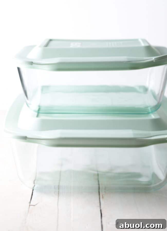 Decadent Banana Pudding Cake 8 Pyrex deep dish baking dishes stacked on top of each other.
