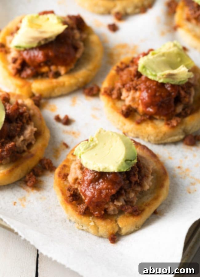 Mexican Sopes with toppings - sauce and avocado