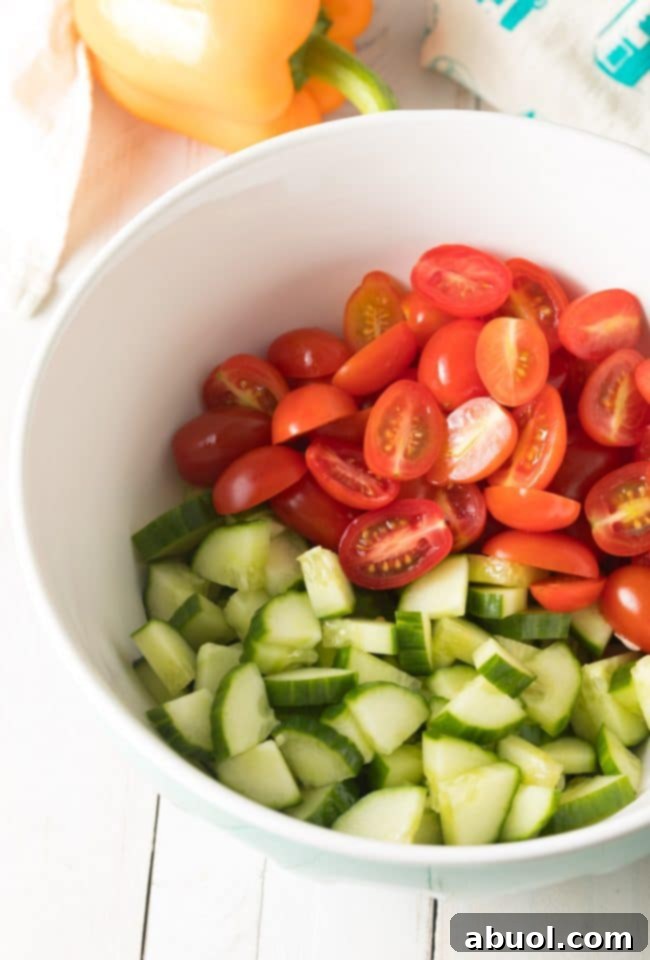 Greek Horiatiki (Village Salad) Recipe - Freshly chopped ingredients neatly arranged and ready for mixing.