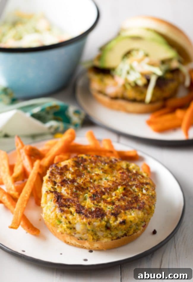 Gourmet Shrimp Burgers 12 A perfectly cooked shrimp patty placed on a toasted hamburger bun, ready for toppings.