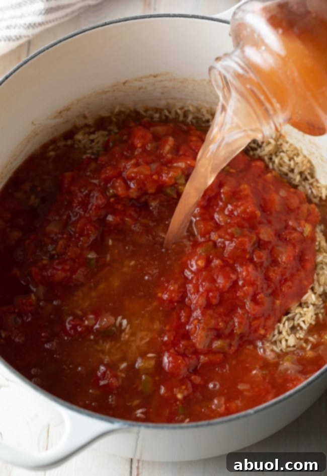 Water being poured into the salsa jar and then into a pot with rice and salsa, ensuring no flavor is wasted.