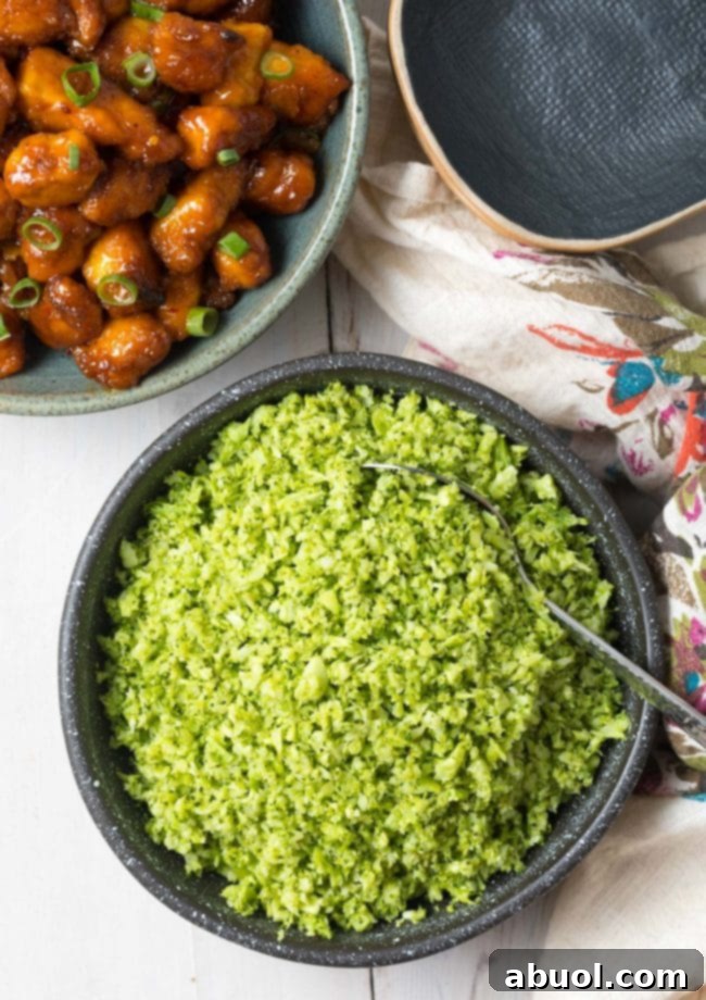 A baking sheet filled with oven-roasted, perfectly seasoned broccoli rice, ready to be served as a healthy and flavorful vegetable side dish.