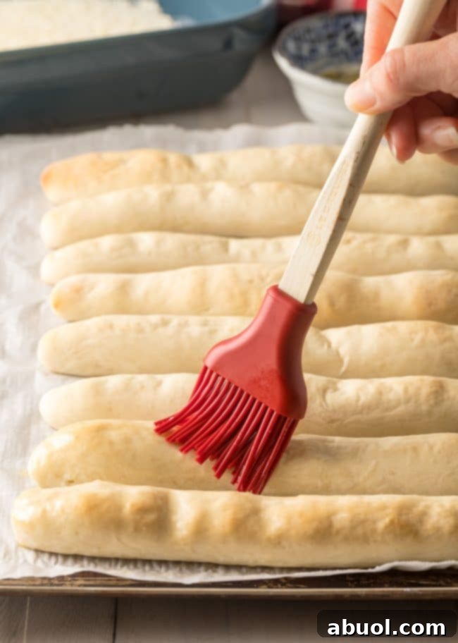 Best Homemade Breadsticks rolled on baking sheet