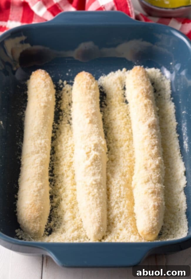 Cheesy Breadsticks Recipe - Crazy Bread - rolled in parmesan cheese