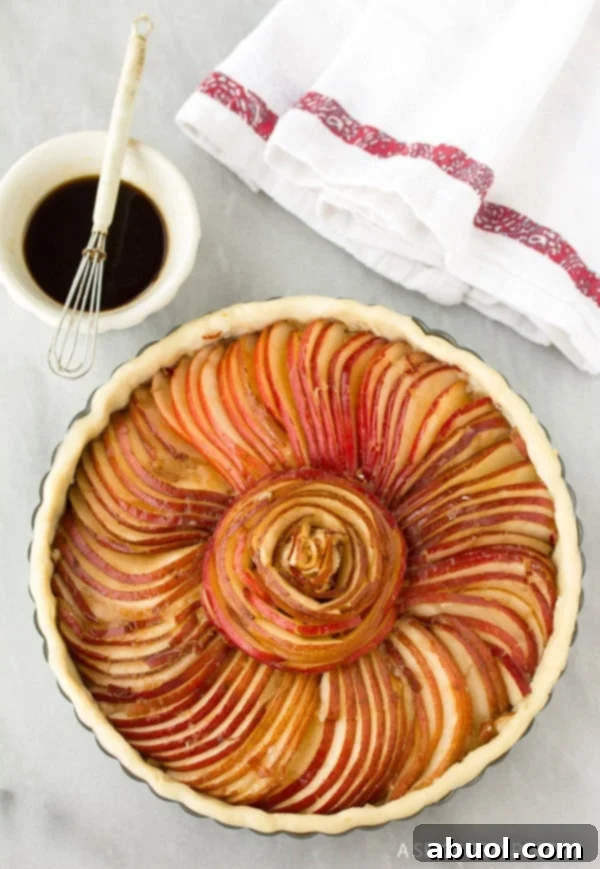 Process of arranging thin pear slices for a Brie and Pear Tart