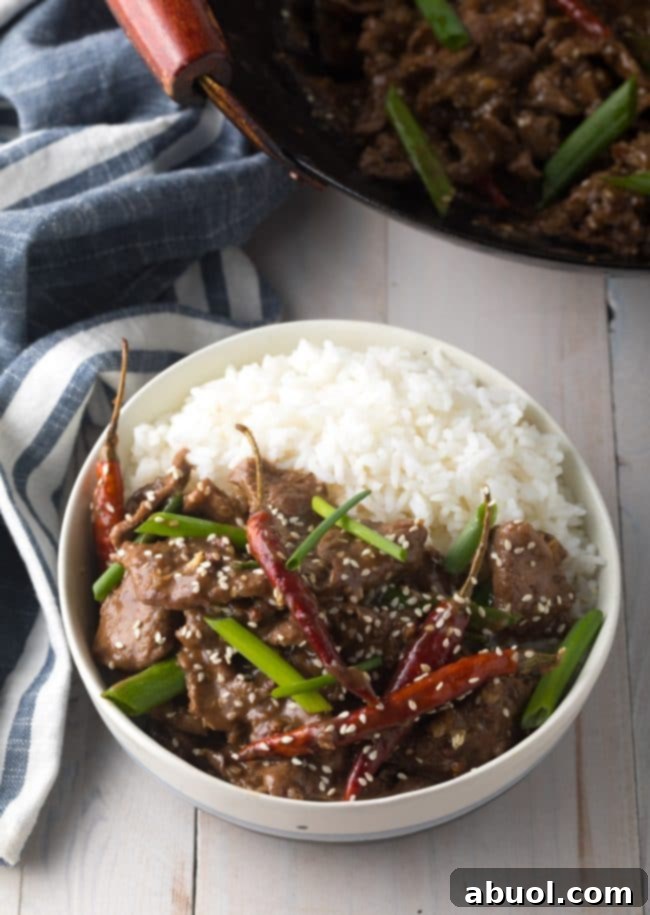 Delicious sesame beef served alongside fluffy white rice, highlighting a perfect meal pairing.