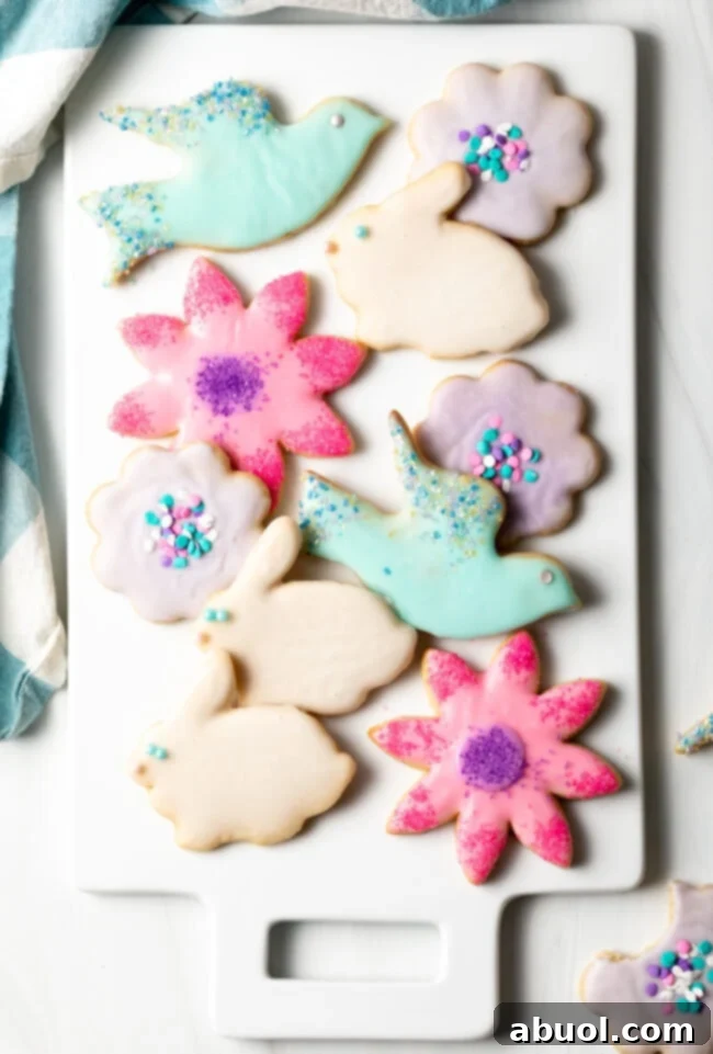 Delightful platter of cut-out sugar cookies with simple, smooth sugar cookie icing, perfect for any occasion.