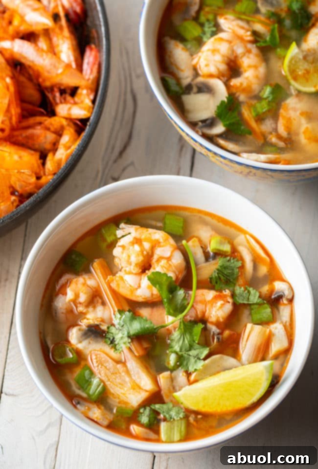 Spicy Thai Tom Yum Perfection 12 Overhead shot of two bowls of shrimp tom yum soup.