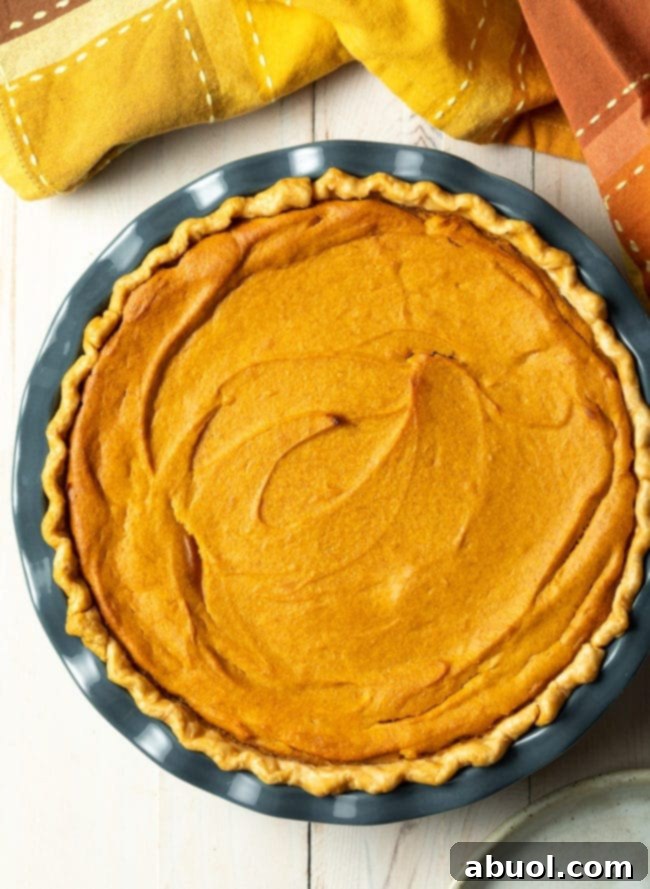 Close-up of baked sweet potatoes, the star ingredient for crafting the perfect Southern Sweet Potato Pie, showing their vibrant orange flesh.