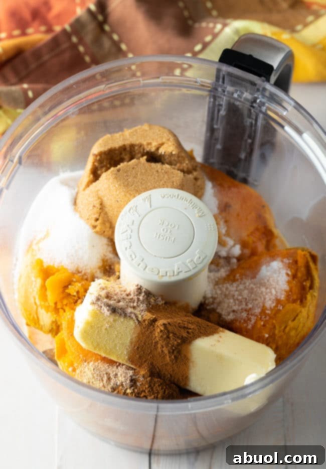The smooth, vibrant puree for Sweet Potato Pie filling, ready for baking – a key step in this easy and delicious recipe.