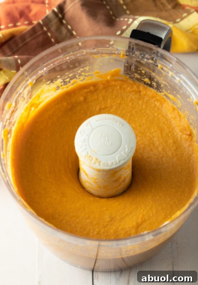 Delicious Sweet Potato Pie filling, rich and creamy, blended perfectly before being poured into the crust for a delectable holiday pie.