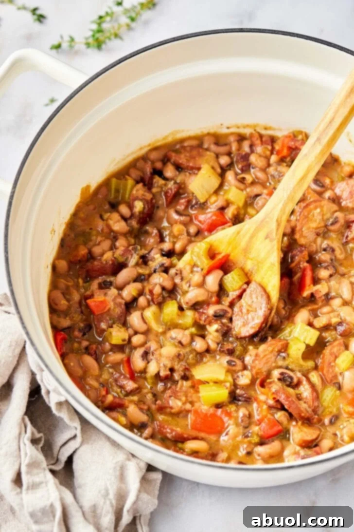 Overhead view of cooked hoppin john in a pot. 