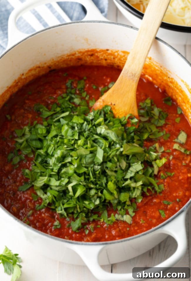 Italian-pasta Meat sauce with sausage simmering in a pot, ready to be combined with ziti for the recipe