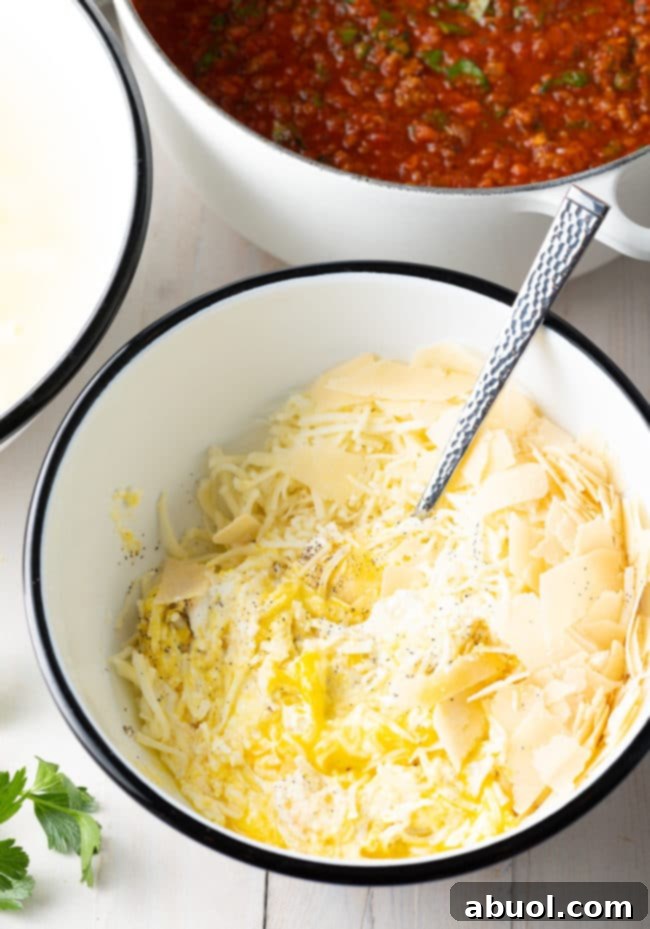 no-boil-method Ricotta mixture in a bowl, prepared for the baked ziti recipe's no-boil method