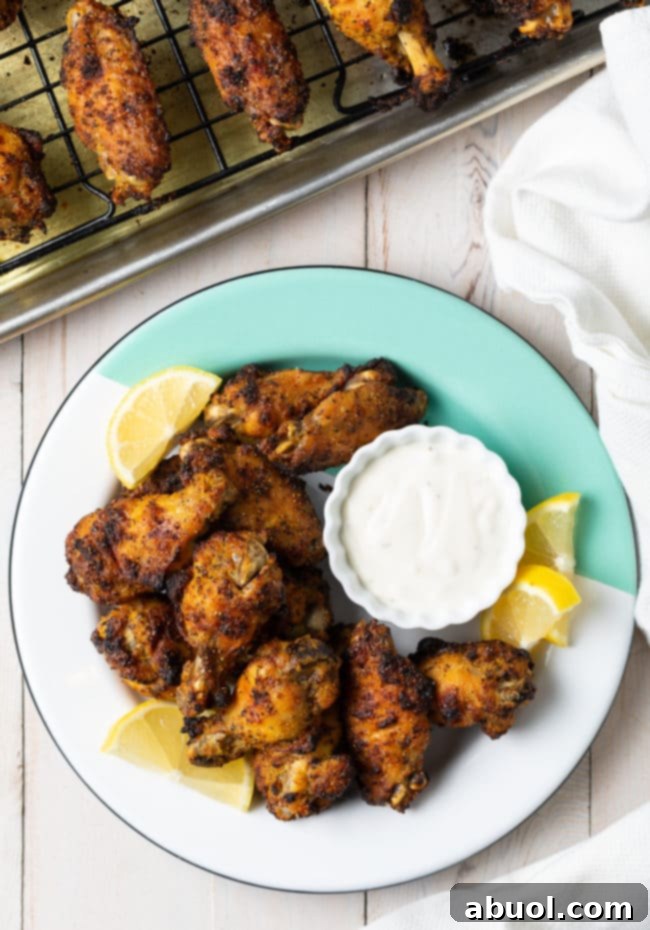 Crispy Baked Lemon Pepper Wings 14 Another appealing shot of lemon pepper chicken wings with garnish.