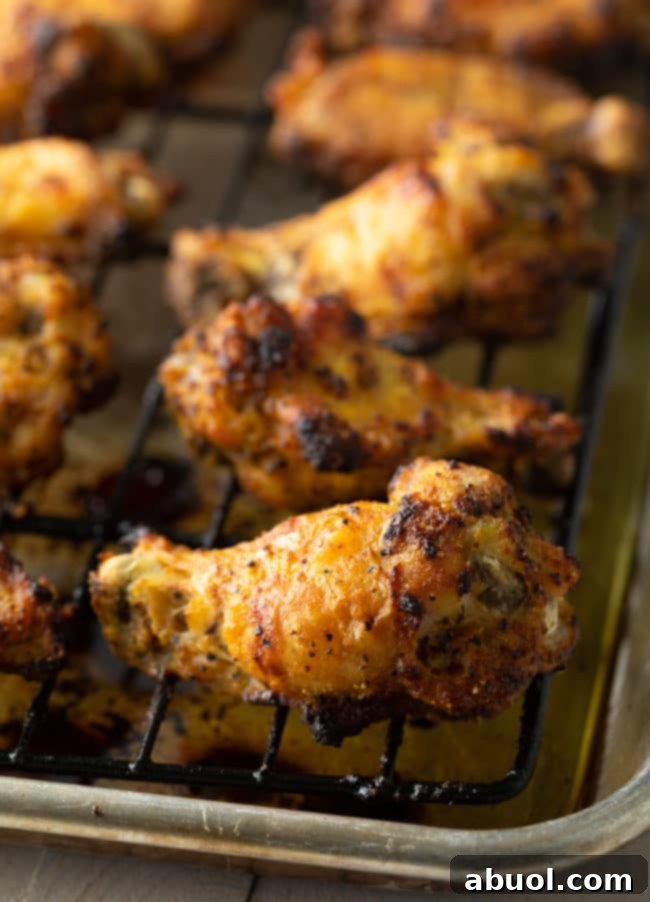 Crispy Baked Lemon Pepper Wings 5 A bowl of fresh chicken wings, seasoned with lemon pepper, ready for baking.