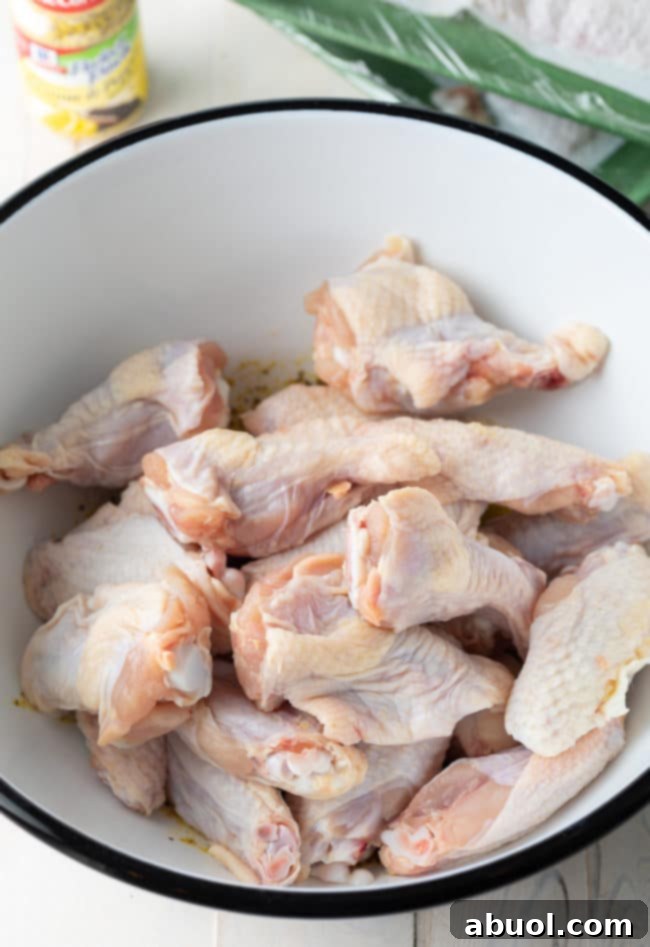 Crispy Baked Lemon Pepper Wings 9 Platter of freshly baked lemon pepper chicken wings, golden and inviting.