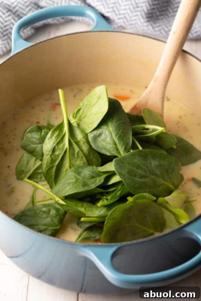 Velvety Lemon Chicken & Spinach Soup 9 How To Make Chicken Soup with Lemon Recipe (Low Carb) #ASpicyPerspective #chicken #soup #chickensoup #creamy #keto #lowcarb #lemon #parmesan #spinach