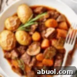 Venison Bourguignon in a white bowl.