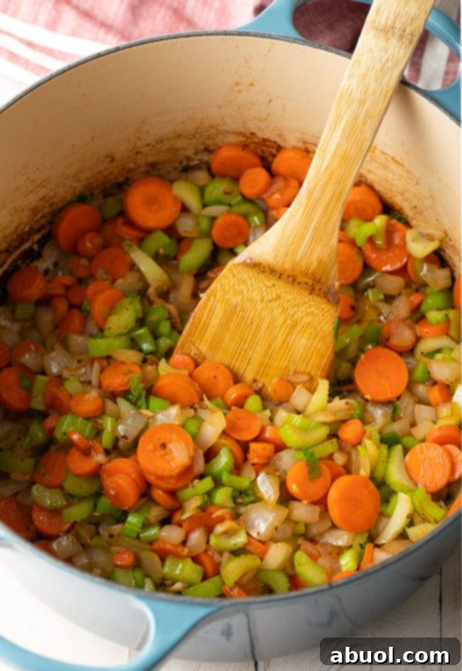 Sauteed vegetables in a pot, softened and fragrant.