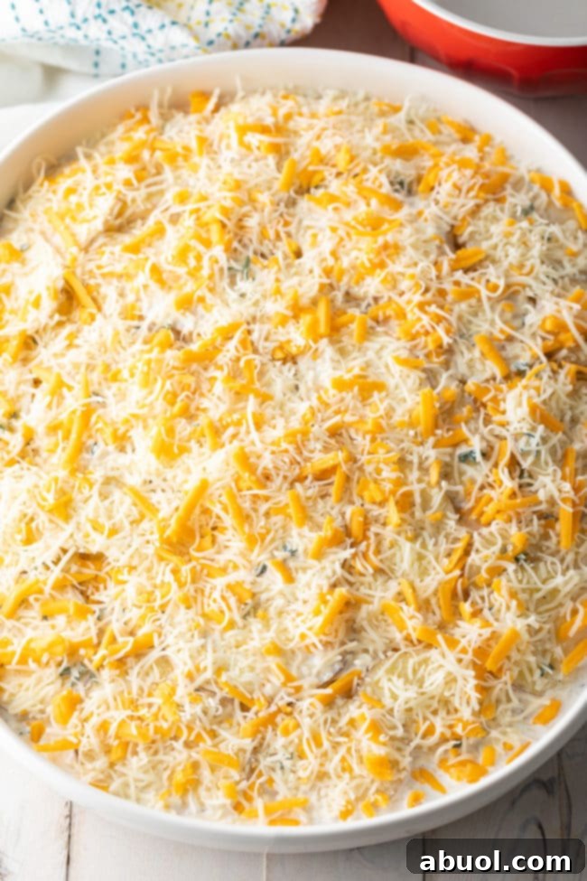 A finished dish of Cheesy Potatoes au Gratin, golden brown and bubbling.