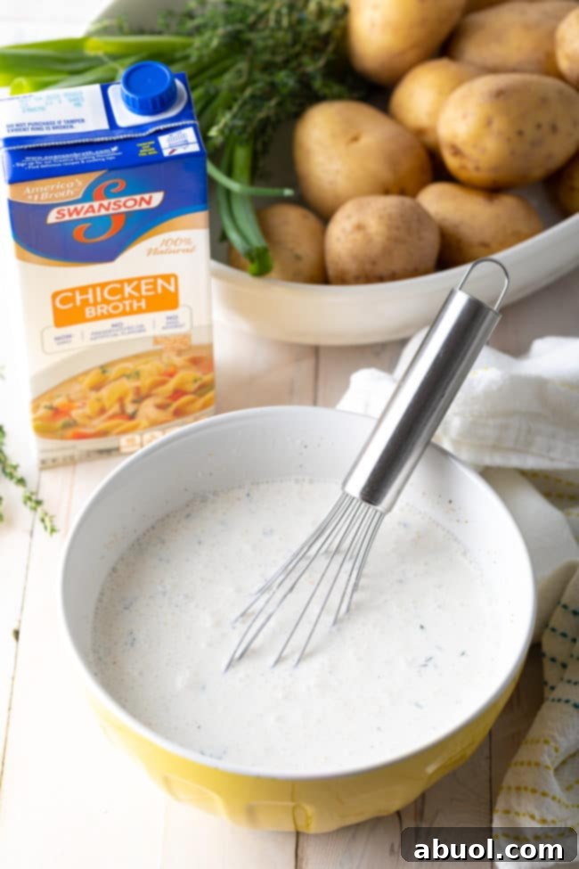 Preparing the creamy sauce mixture for Scalloped Potatoes au Gratin.