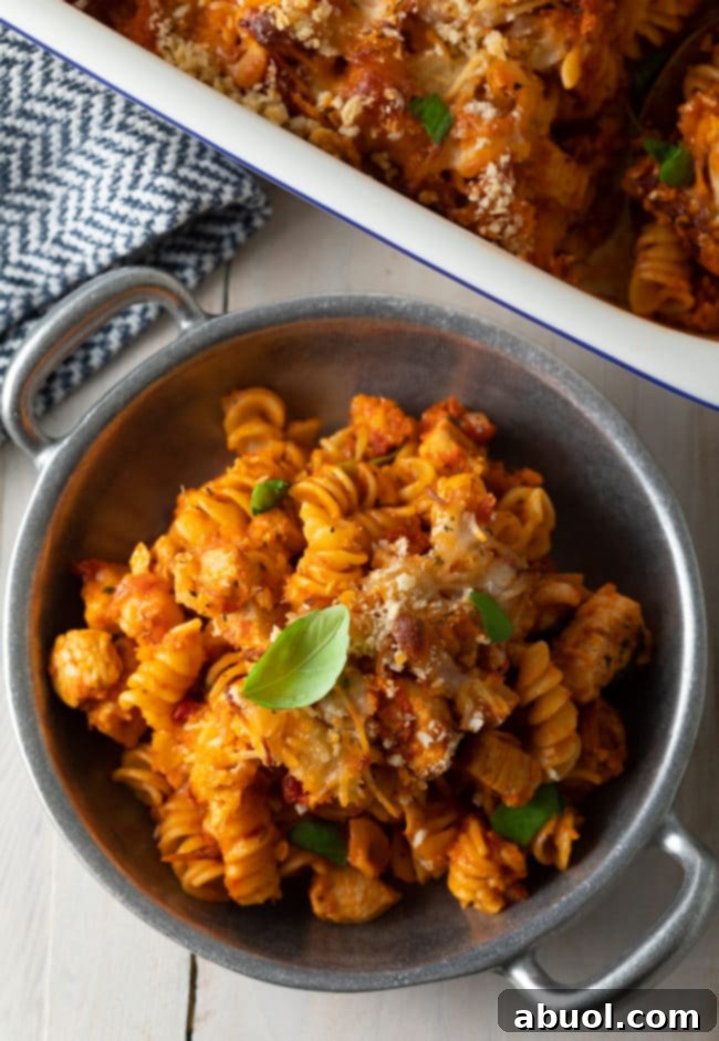 Effortless No-Boil Chicken Parmesan Pasta 4 Portion of chicken parmesan pasta in a metal bowl.