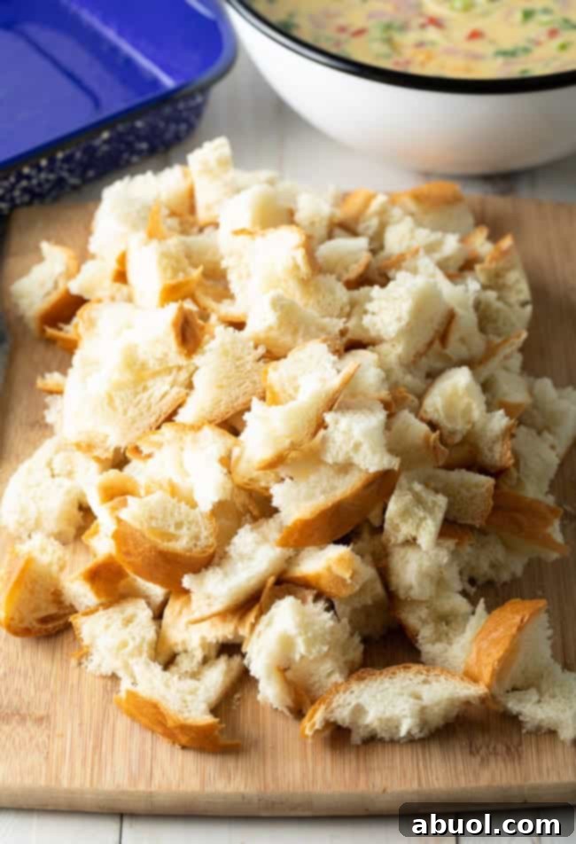 Crusty French bread, torn into pieces, ready for making breakfast strata