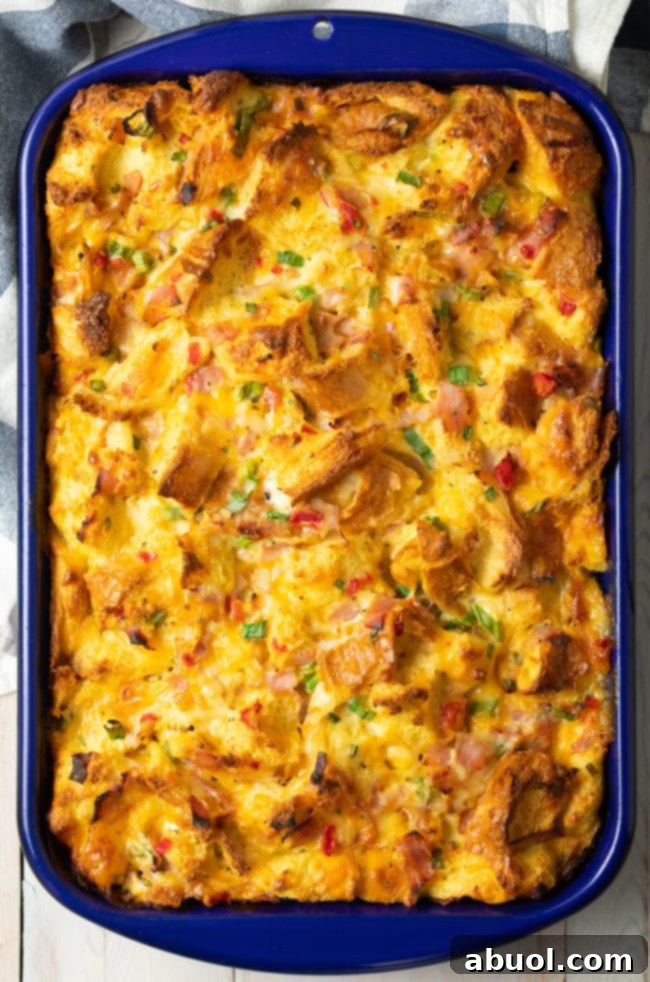 Strata egg bake with bread, ham, and cheese (overnight breakfast casserole) in a baking dish