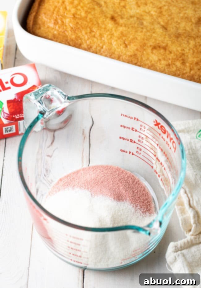 Jello Cake Recipe ingredients in measuring pitcher