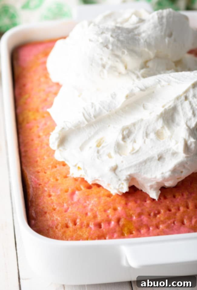 Strawberry-Coconut Jello Cake Recipe - cake chilling