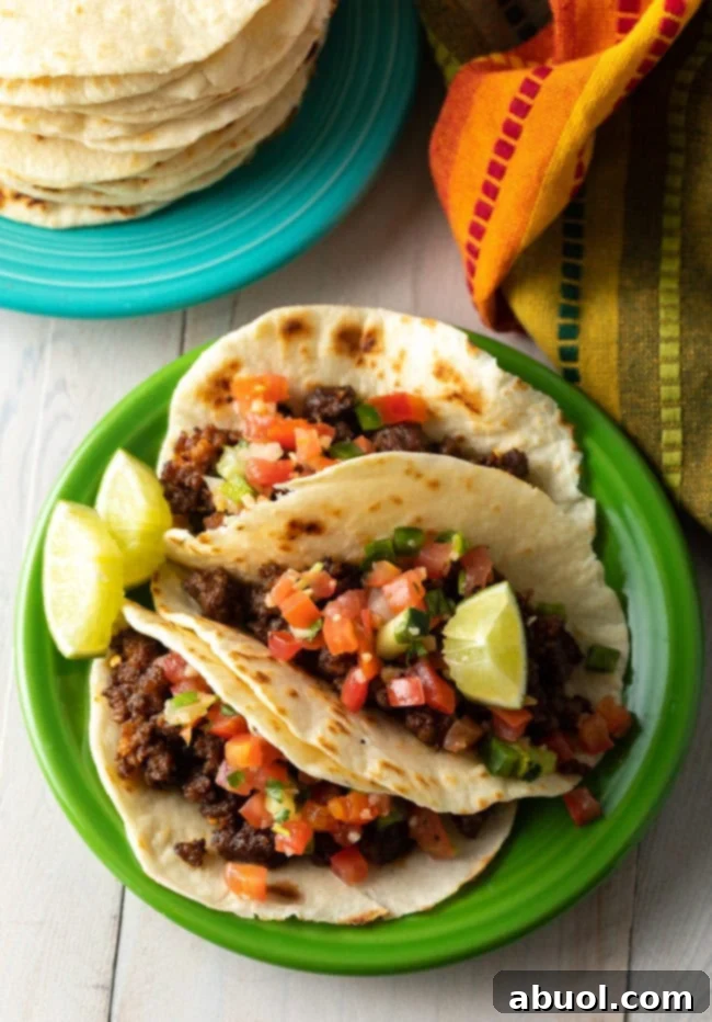 Best Homemade Flour Tortilla Recipe for tacos - filled tacos on plate 