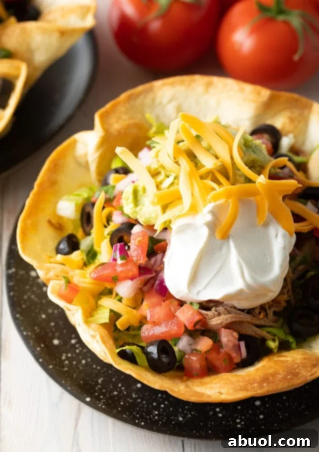 A close-up shot of a finished homemade tortilla bowl, showcasing its golden color and inviting texture.