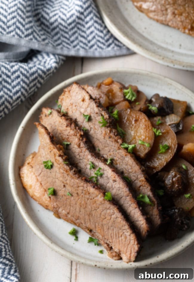 The best slow cooker beef brisket with potatoes and onions, perfect for meal prepping
