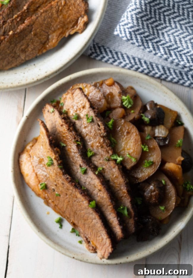 The best beef brisket made in the slow cooker with a delicious sweet and smoky rub